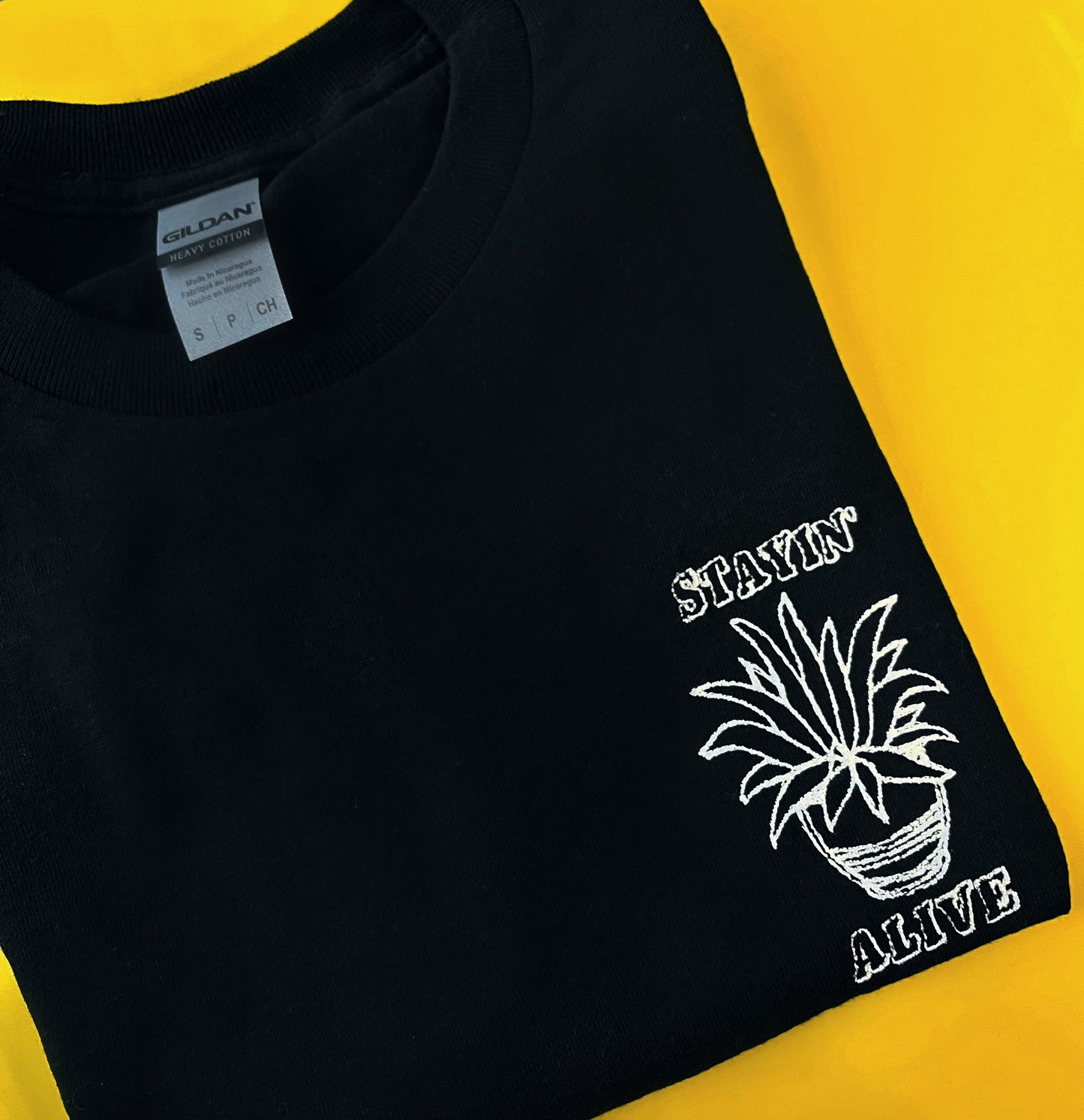 Stayin’ Alive - Unisex Embroidered Print. Black/White/Grey