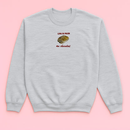 Life Is Pain Au Chocolat - Embroidered Unisex Sweaters