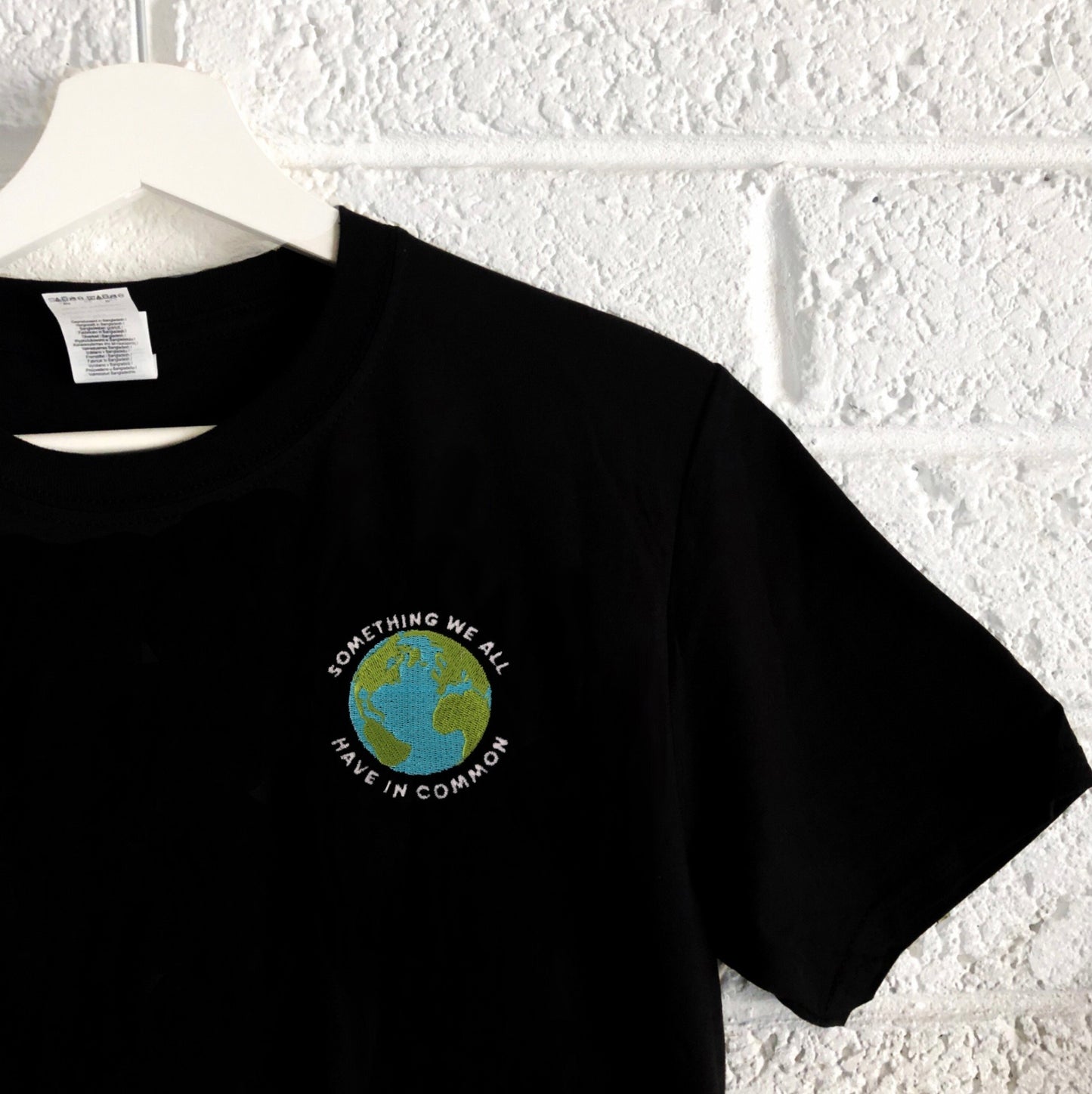 Something We All Have In Common - Unisex Embroidered Tees